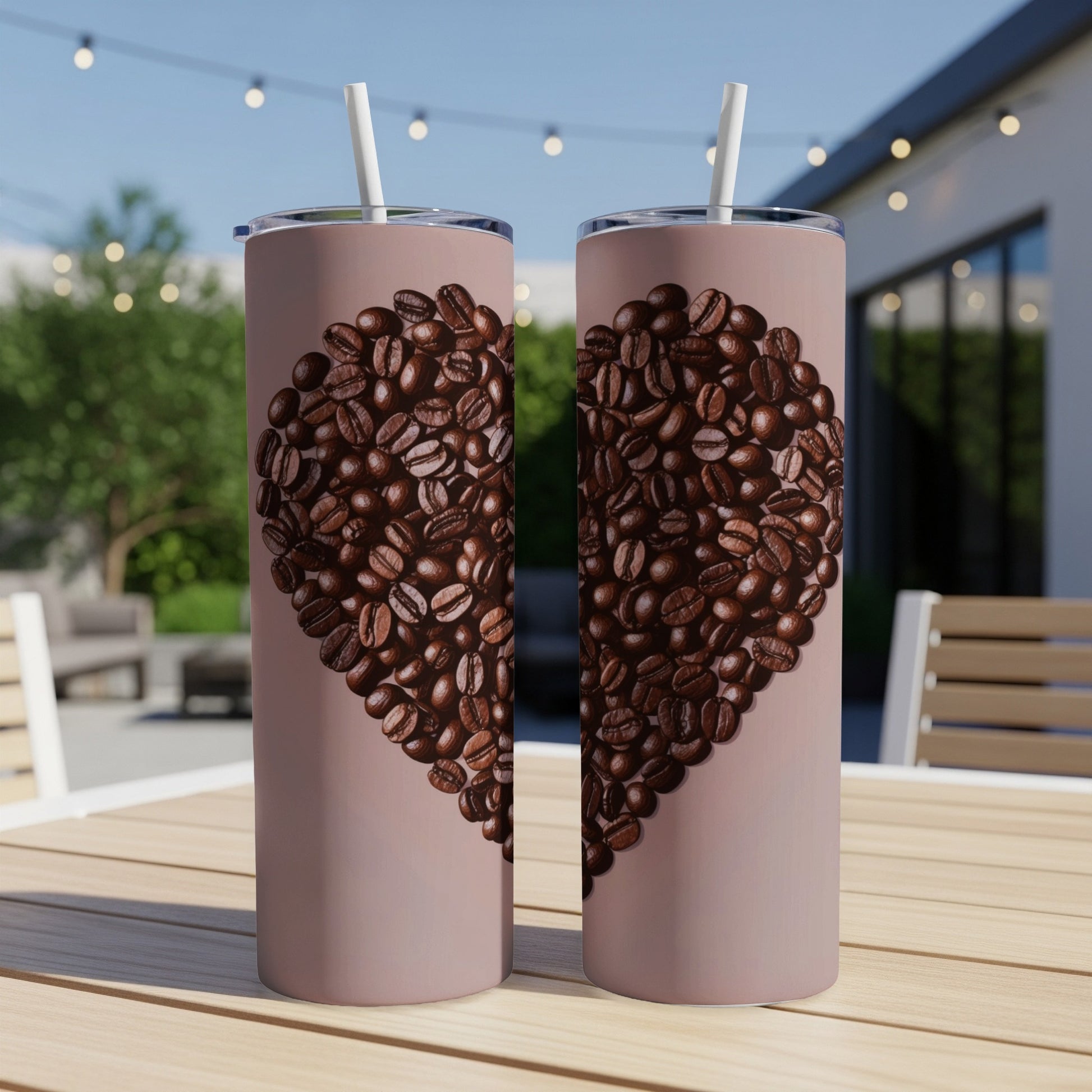 Two tall, pink tumblers with a heart made of coffee beans.
