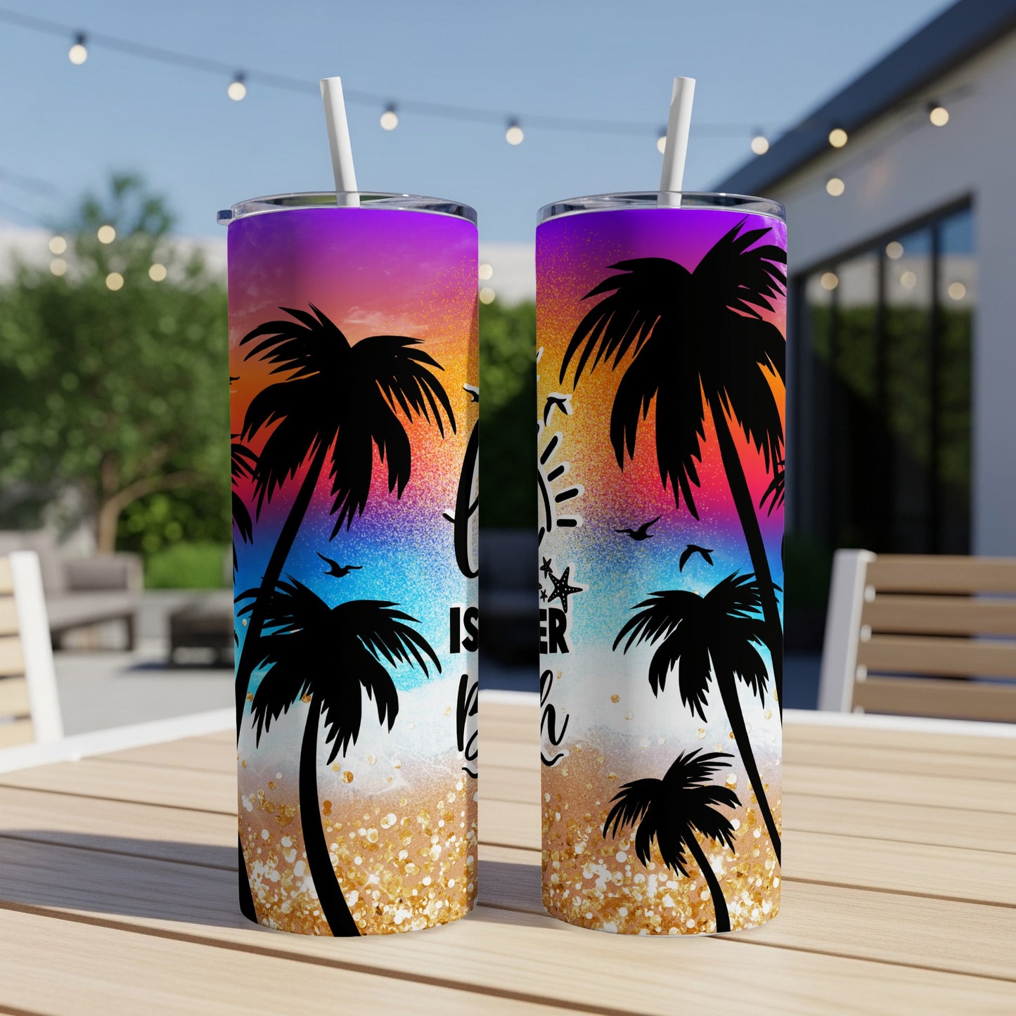 Two tumblers with a sunset beach scene and palm trees.