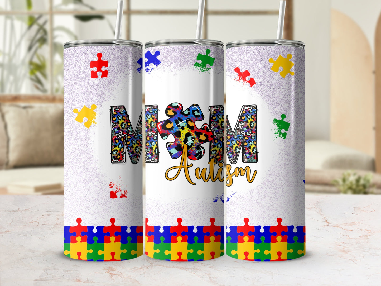 "Mom" and "Autism" text with colorful puzzle pieces and leopard print on a tumbler.