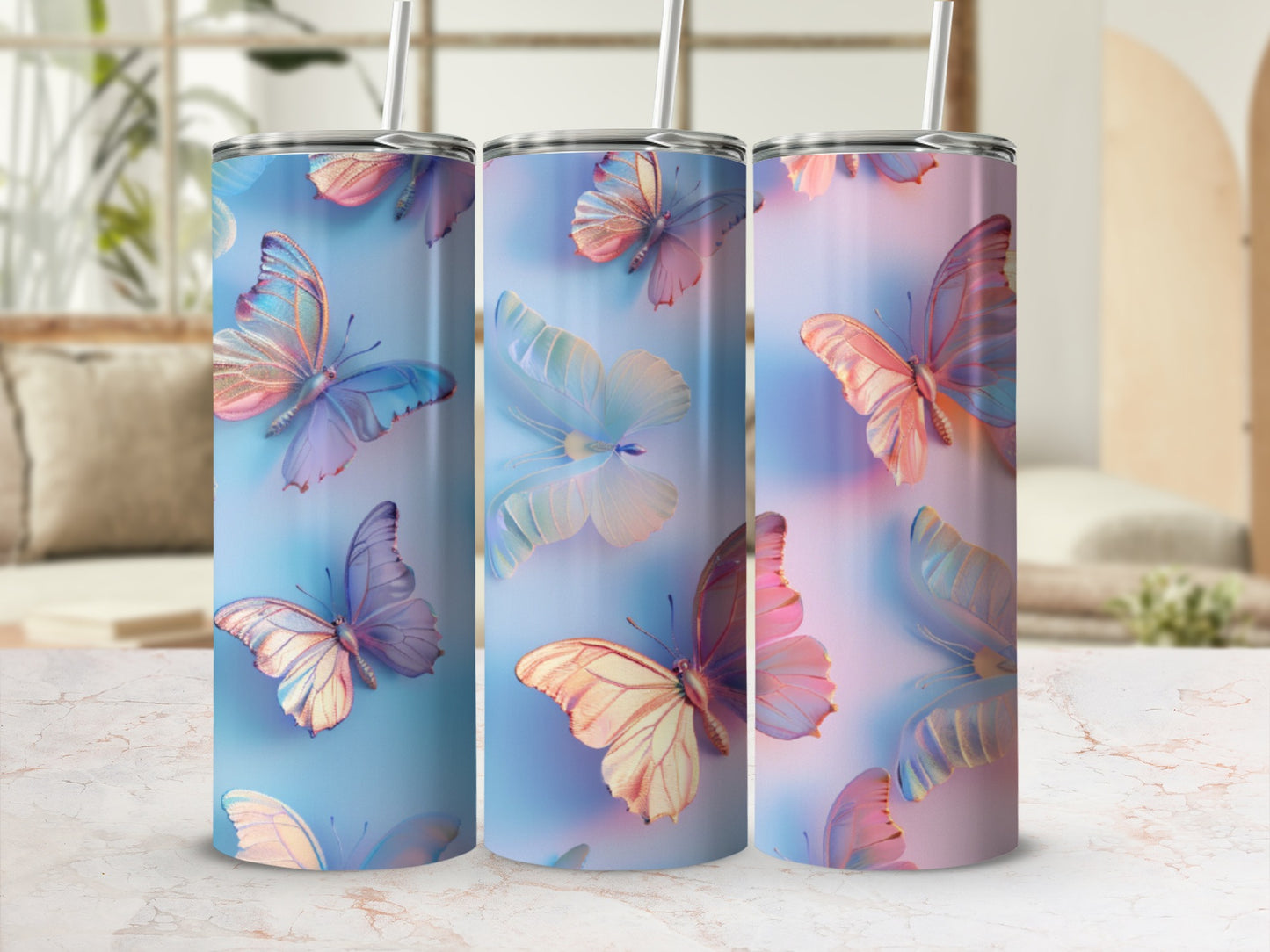 Three iridescent butterflies on blue and pink gradient tumblers.