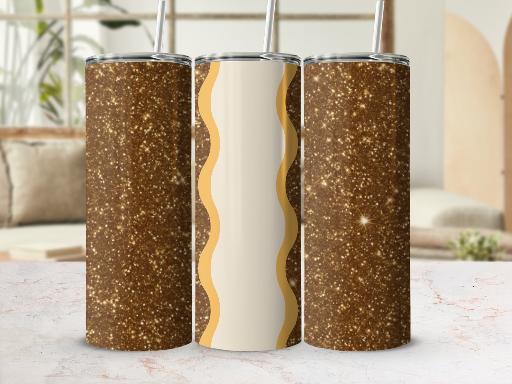 Three tall, skinny tumblers with a speckled gold glitter design.