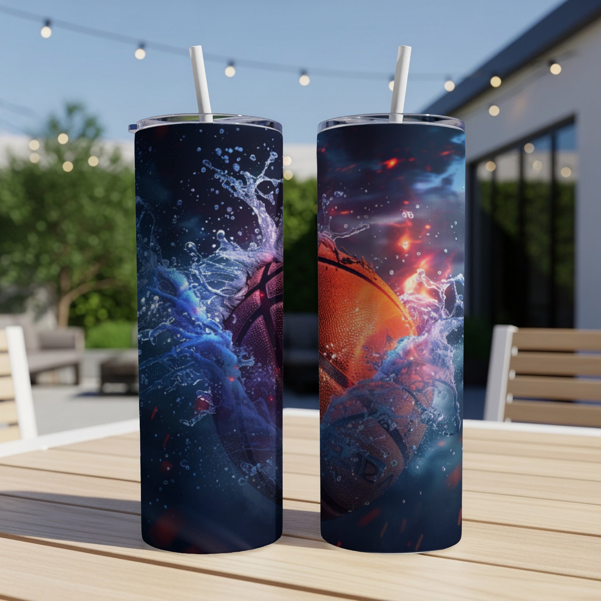 Two tumblers with dynamic basketball splash graphics on an outdoor table.