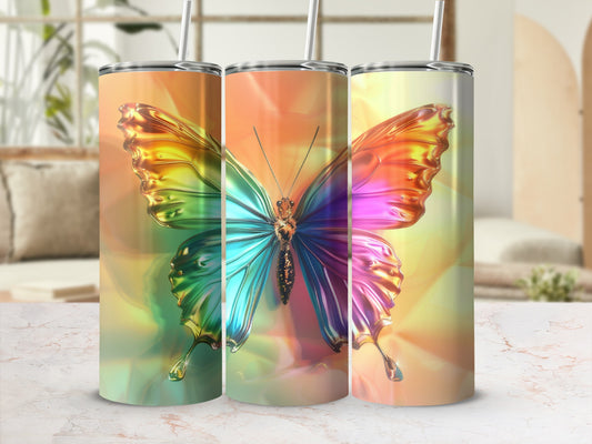 Iridescent butterfly design on three insulated tumblers with straws.