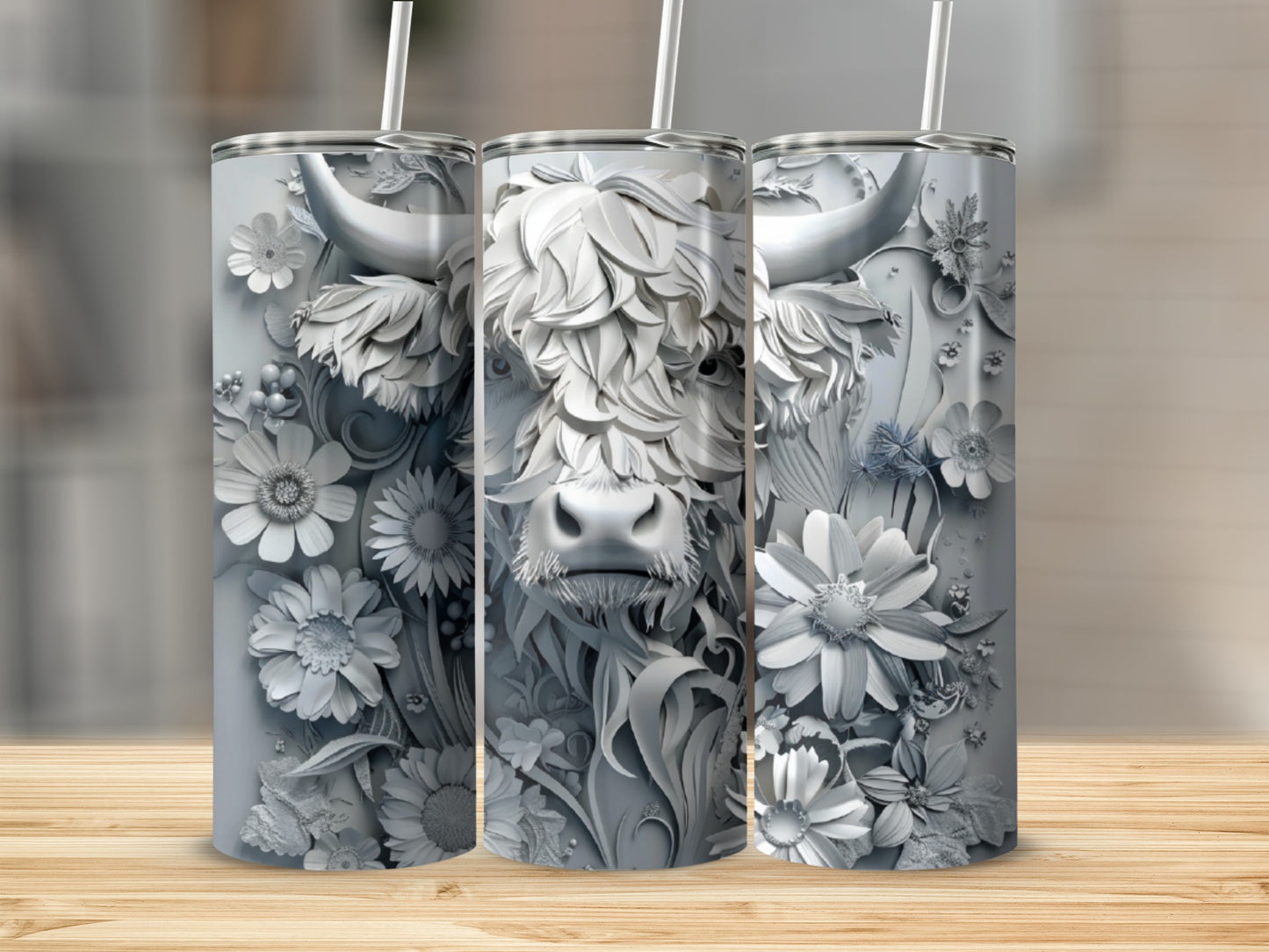 Silver tumbler with a detailed Highland cow and floral relief design.