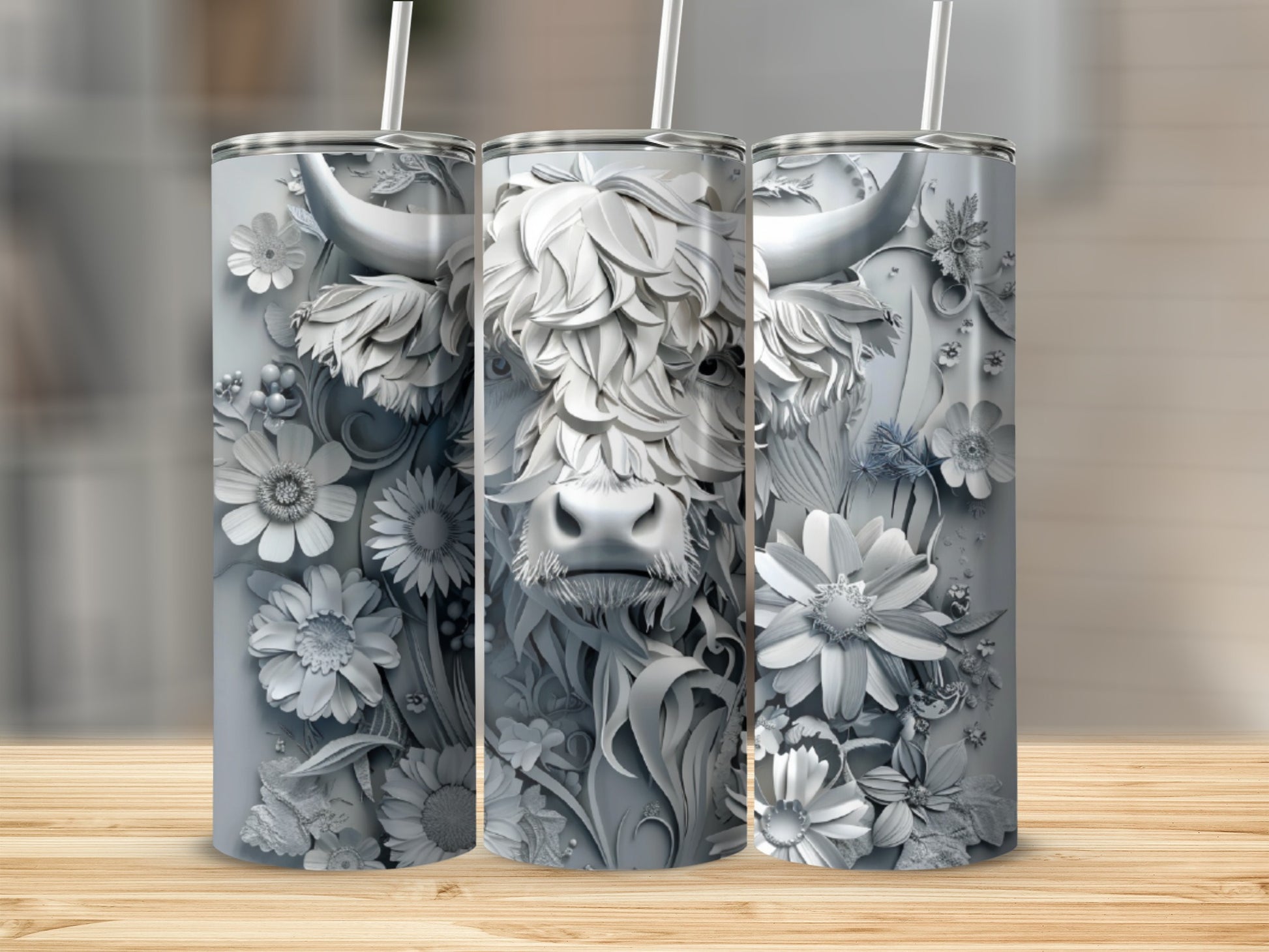 Silver tumbler with a detailed Highland cow and floral relief design.