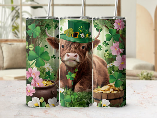 Cow wearing a green hat and shamrock necklace, surrounded by clover and flowers.