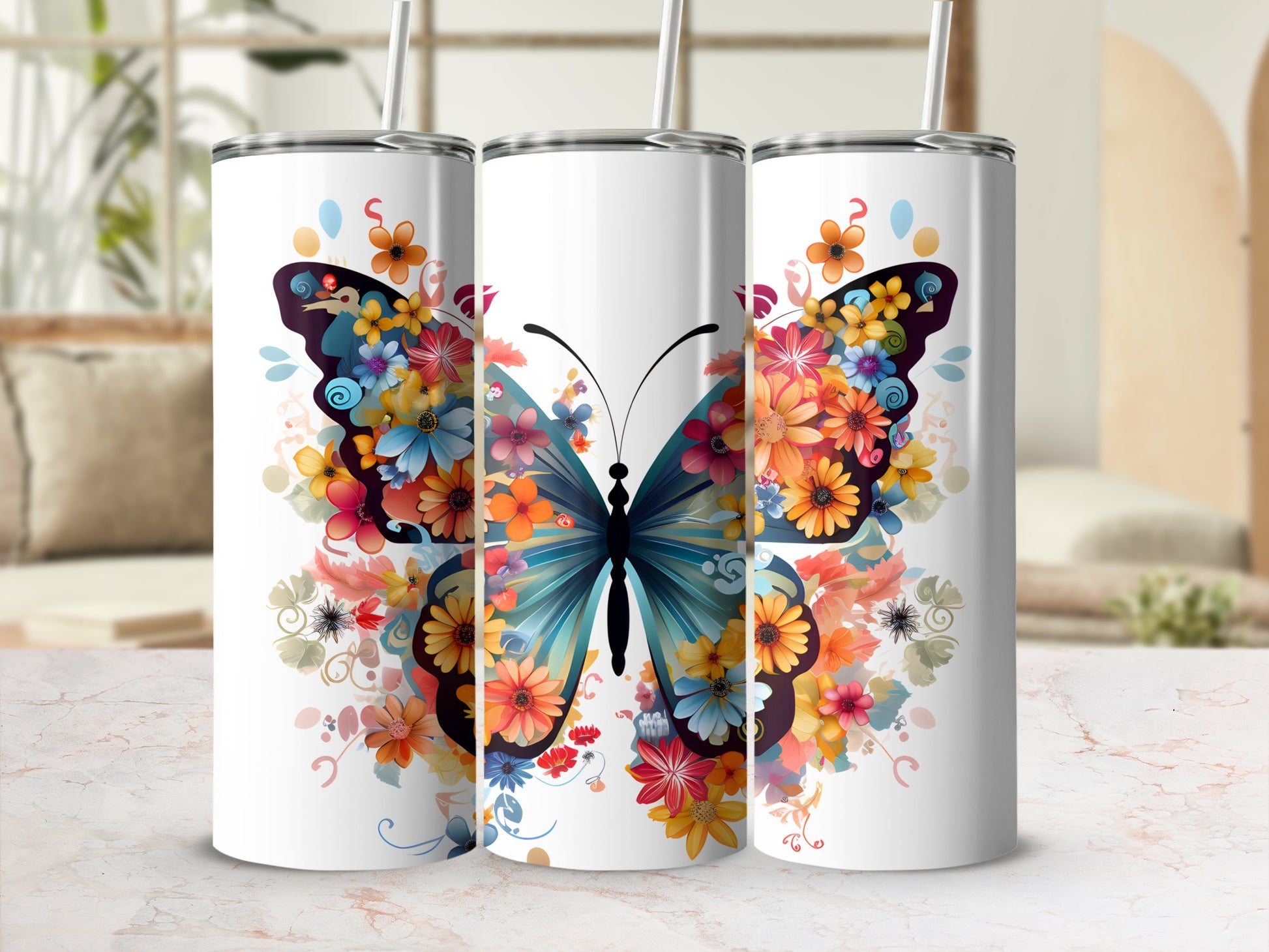 Three tumblers with a colorful butterfly and floral design.