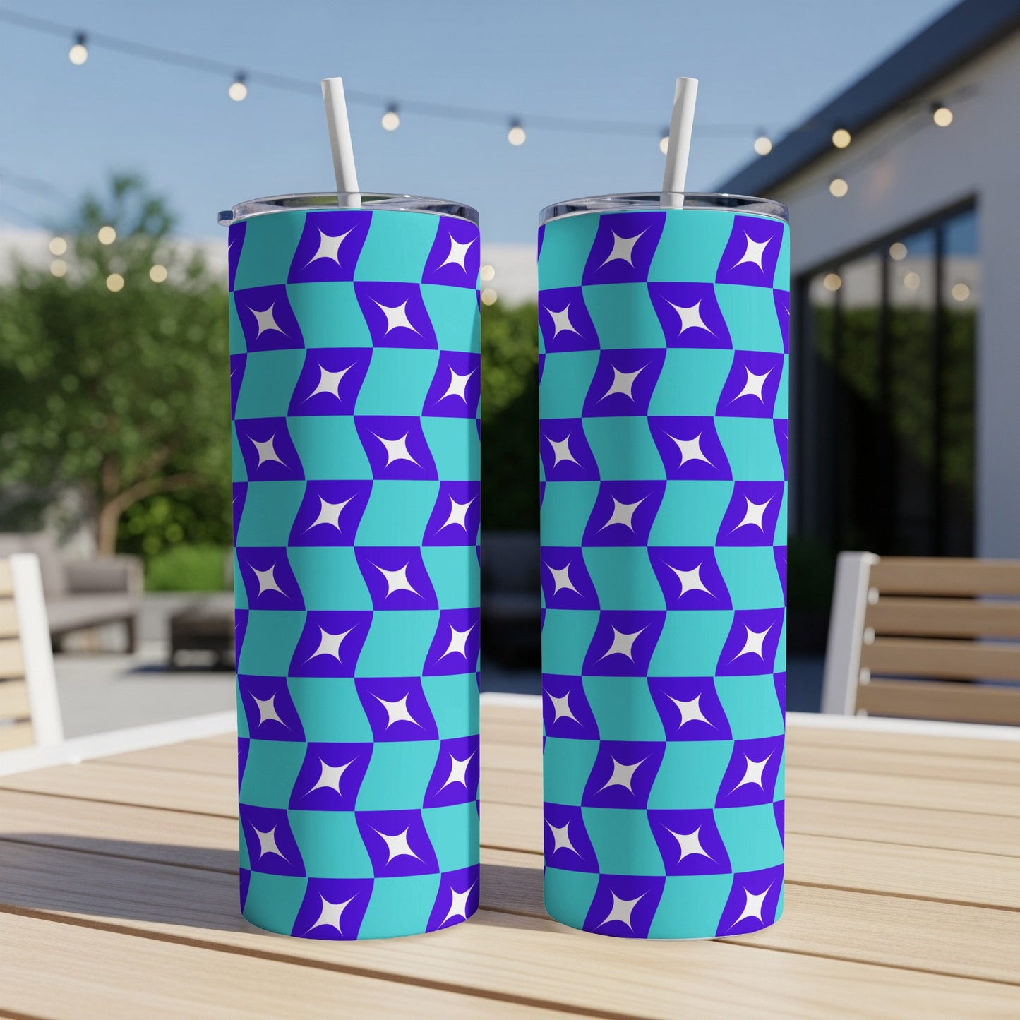 Two tumblers with a blue and purple geometric pattern, each with a white straw.