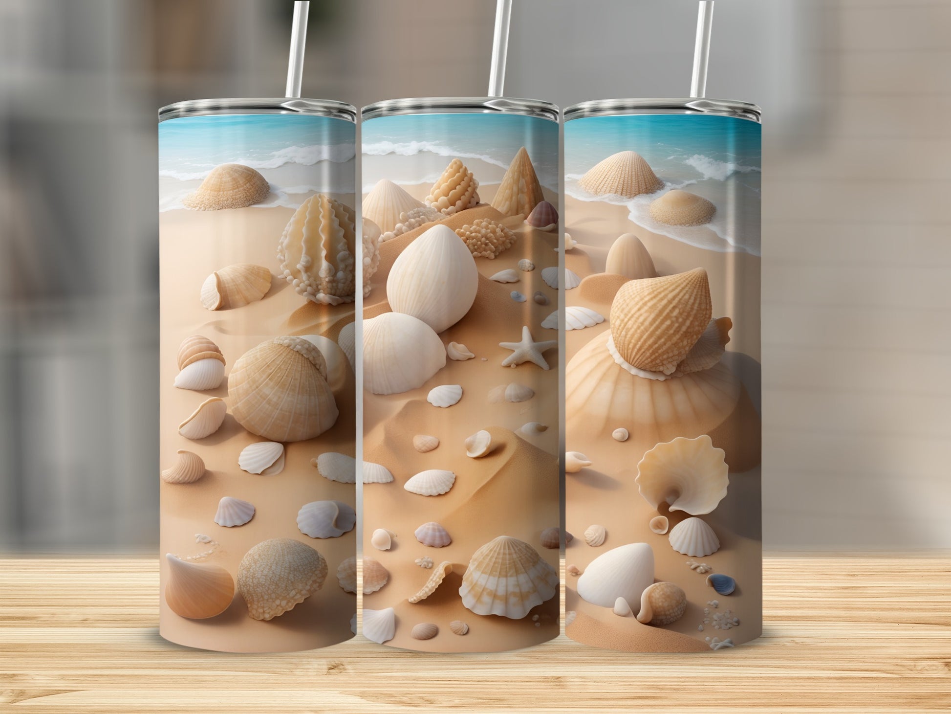 Three tumblers decorated with seashells and ocean waves.