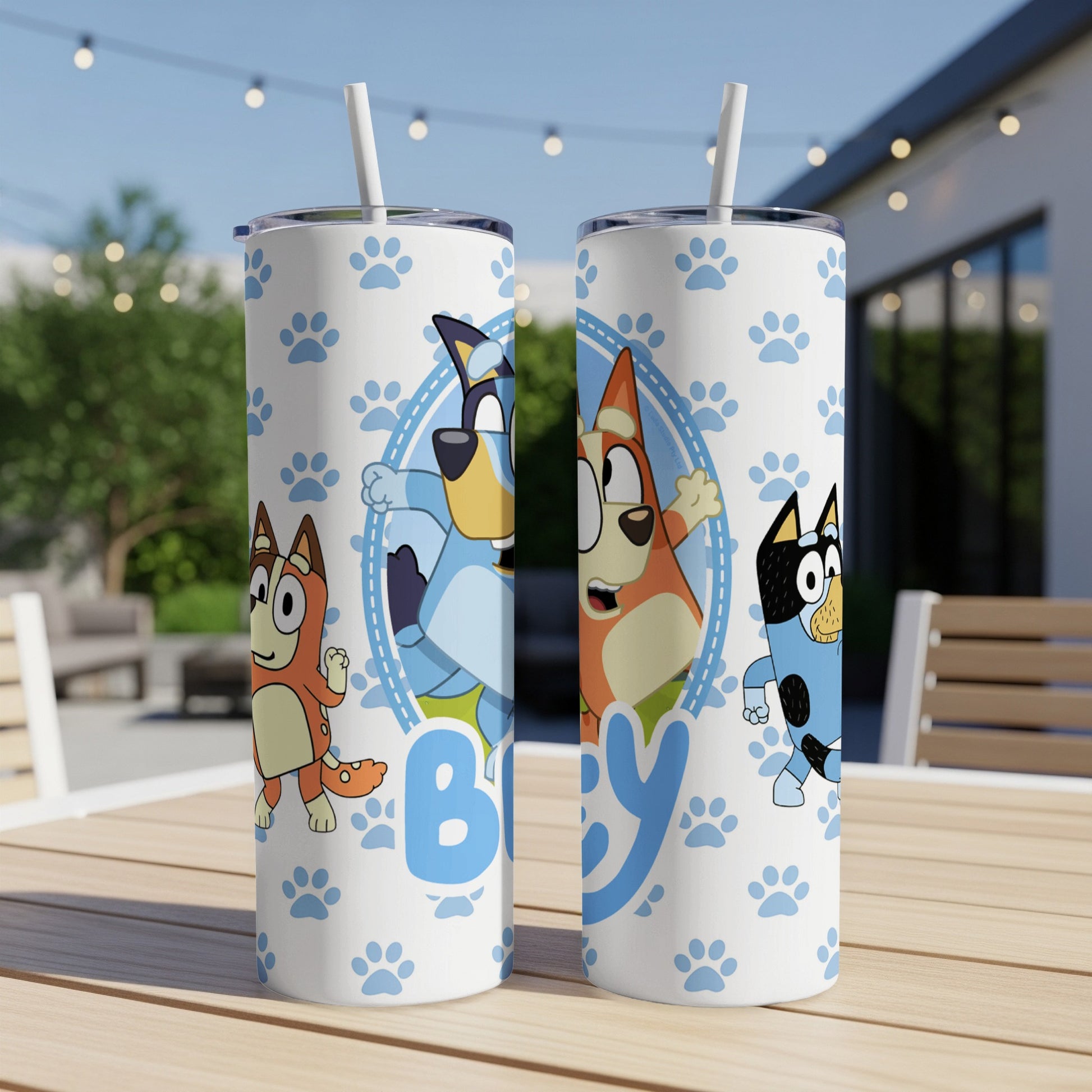 Bluey and Bingo characters on a white tumbler with blue paw prints.