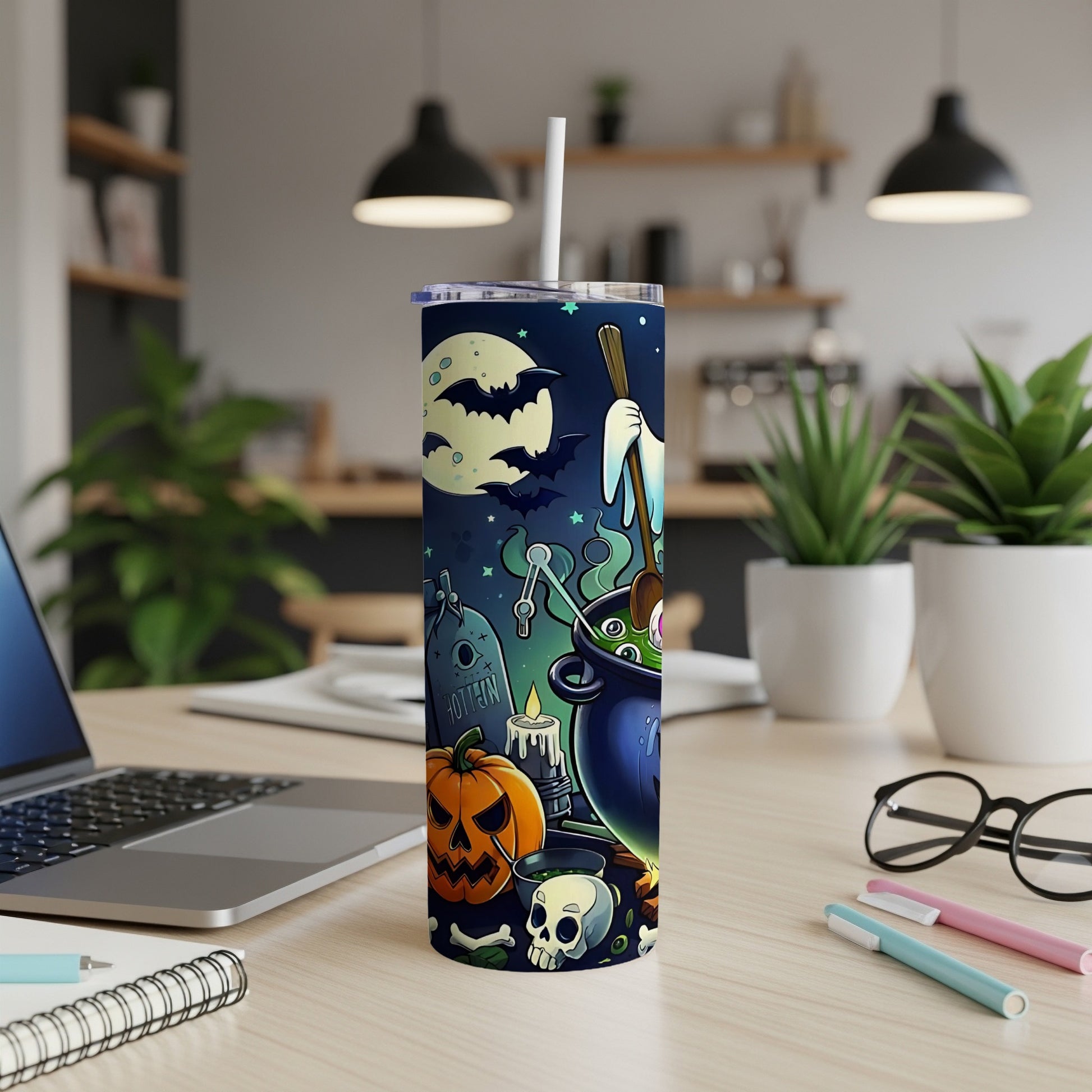 Halloween tumbler with spooky graveyard, pumpkin, skull, and cauldron design.