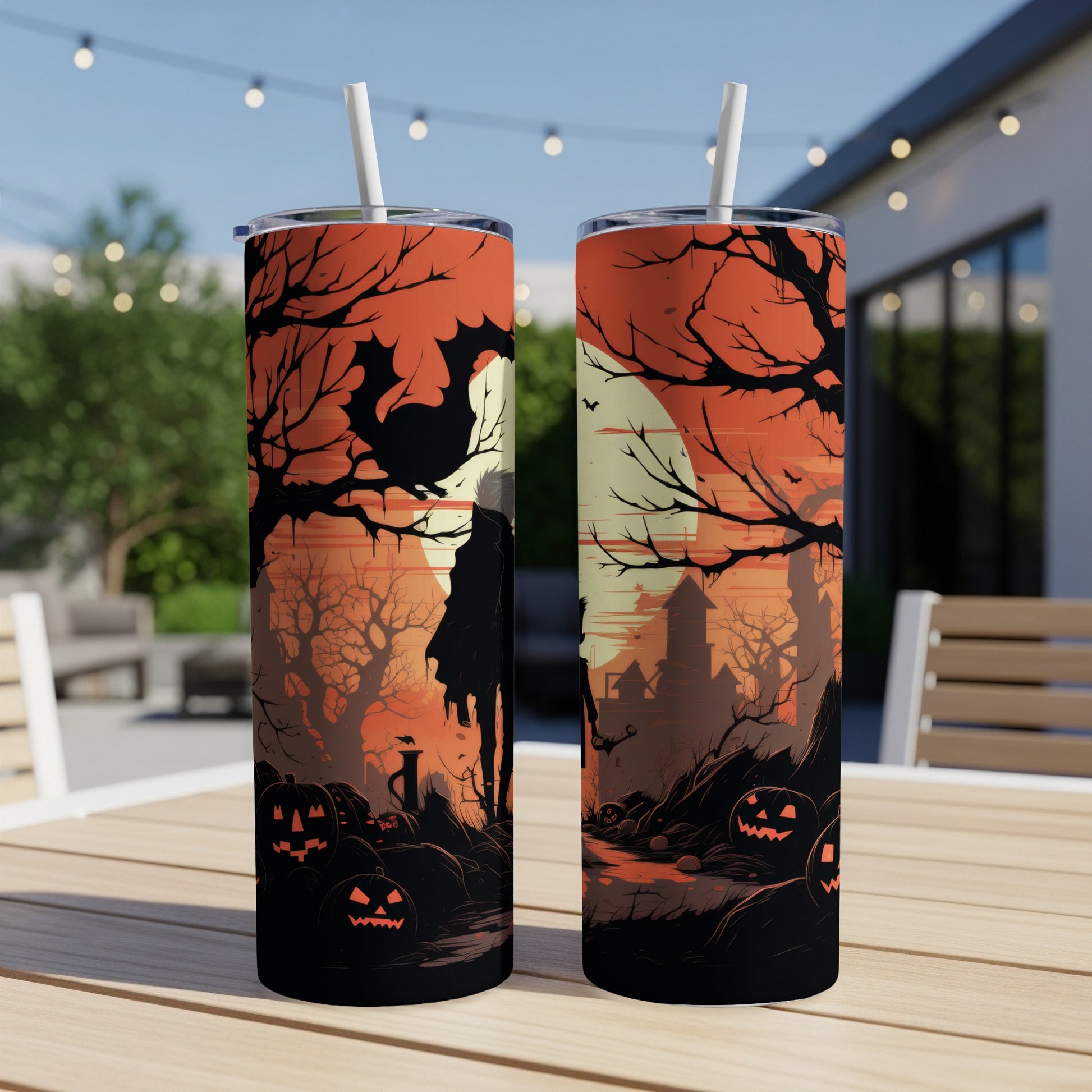 Halloween tumblers with spooky trees, pumpkins, bats, and a silhouette figure.