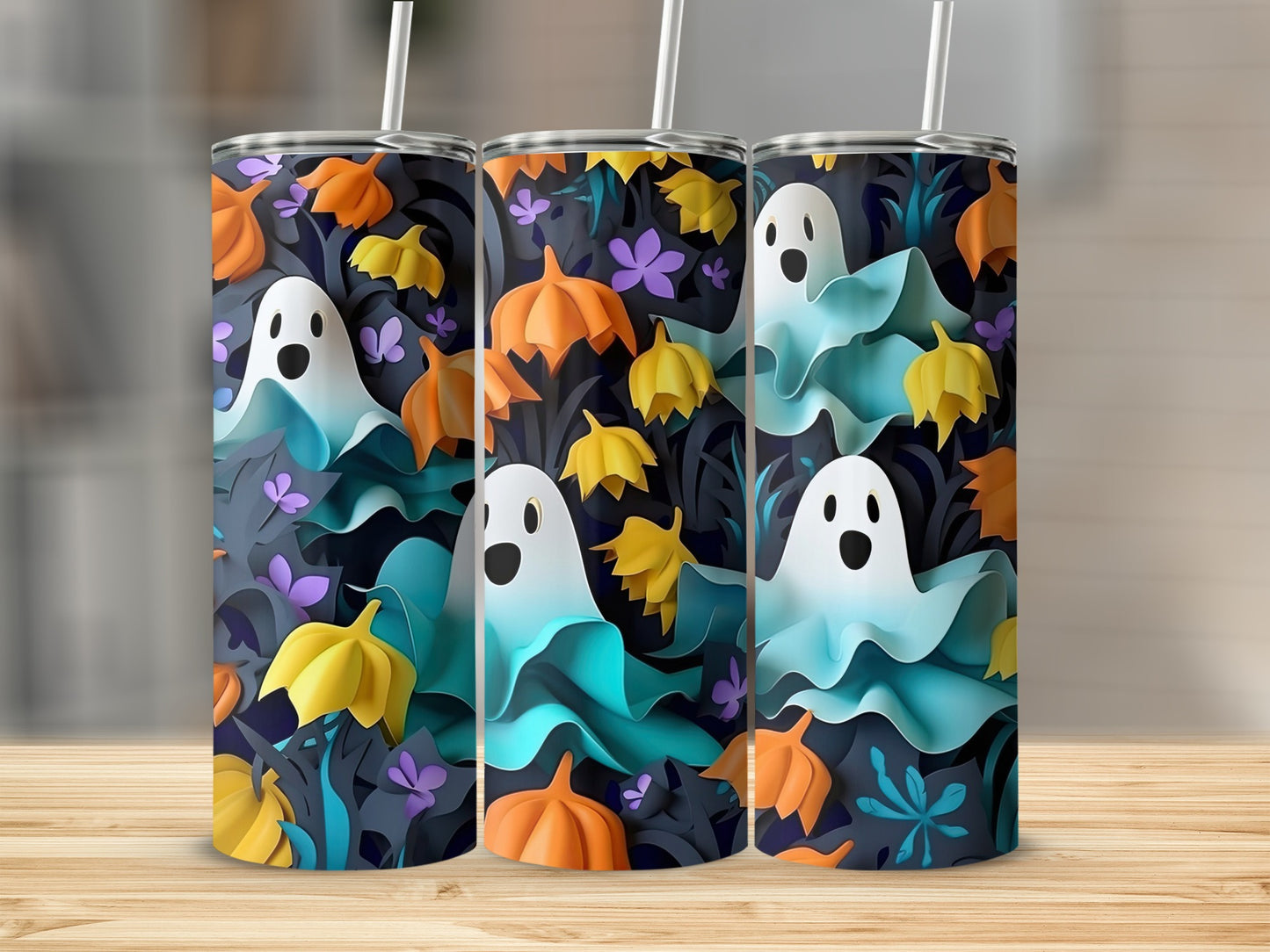 Three tumblers with a Halloween pattern of ghosts, pumpkins, and leaves.