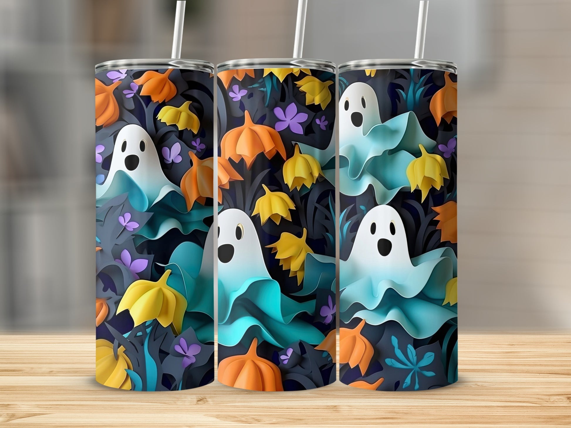 Three tumblers with a Halloween pattern of ghosts, pumpkins, and leaves.