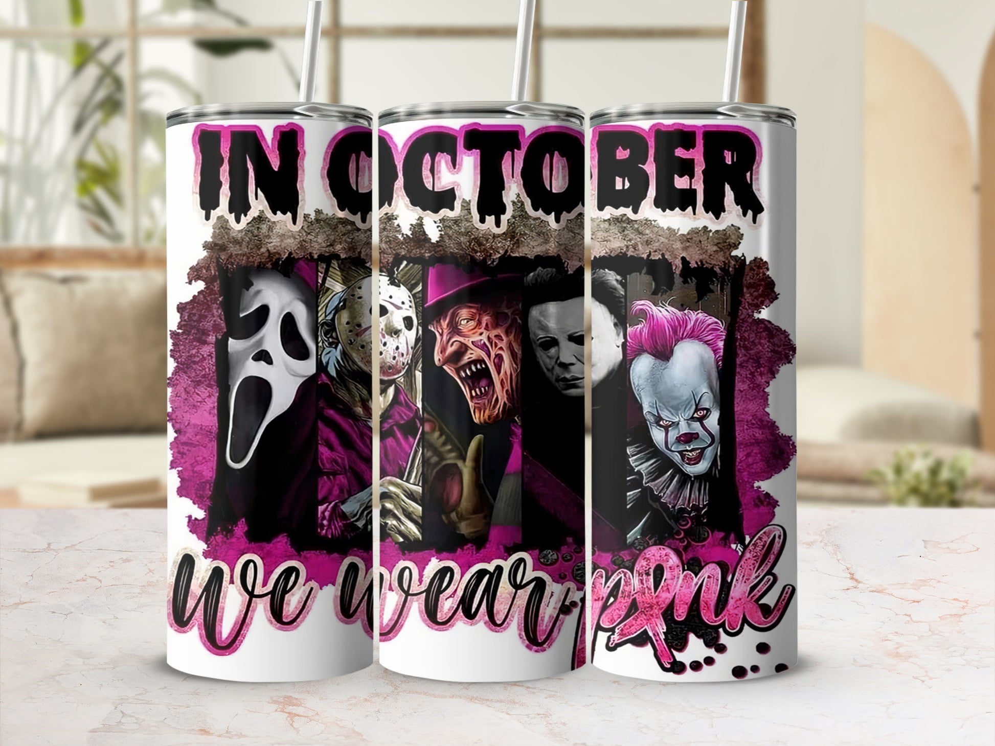 Tumbler with horror characters and text "In October We Wear Pink".