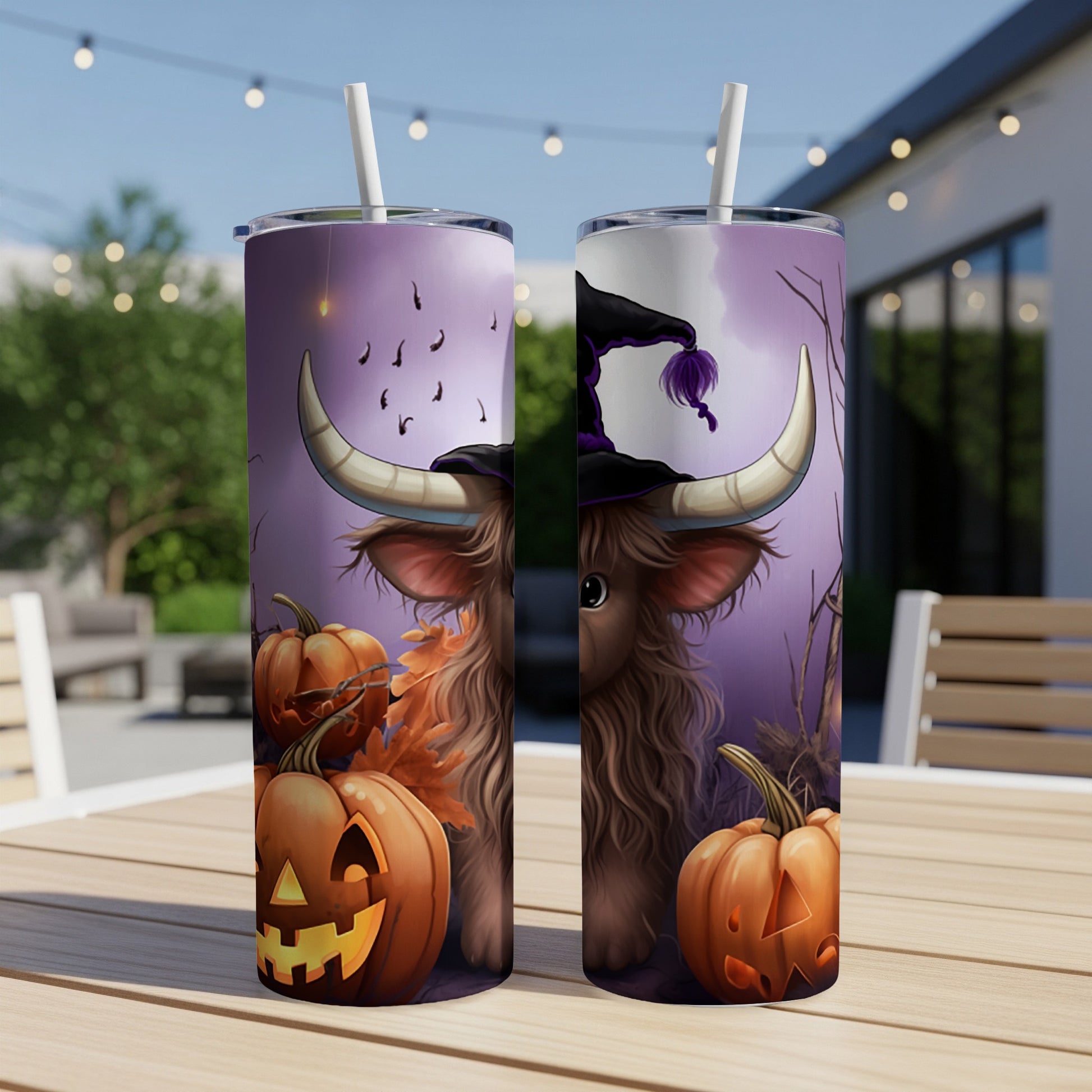 Two Halloween tumblers with a cow in a witch hat, pumpkins, and bats.
