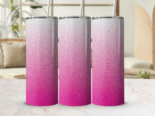 Three glitter tumblers with pink and white gradient on a marble countertop.