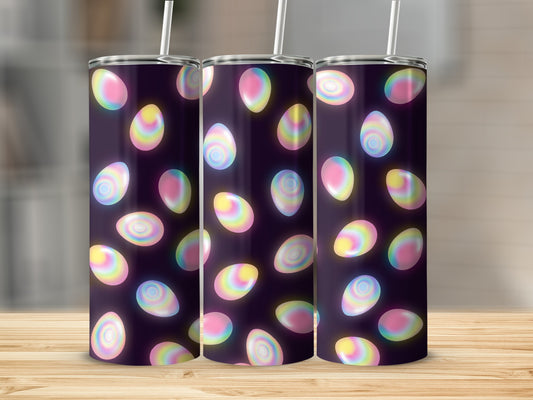 Tumblers with glowing, colorful Easter egg pattern against a dark background.