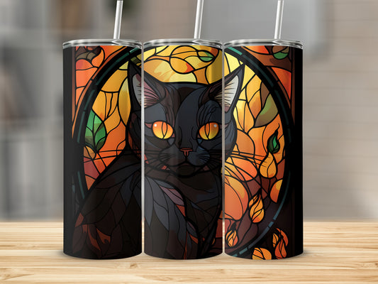 Black cat with bright orange eyes on a stained glass design tumbler.