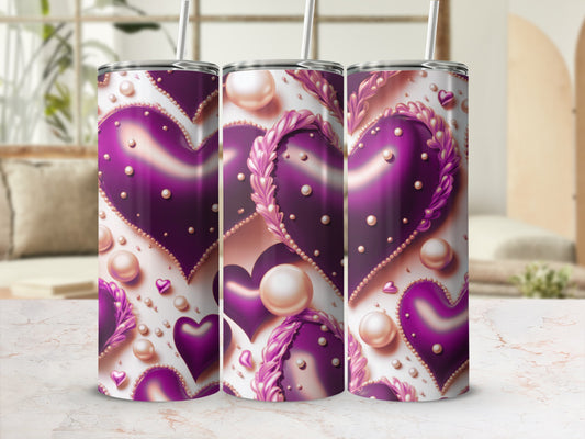 Purple hearts with pearl accents on a tumbler with a straw.