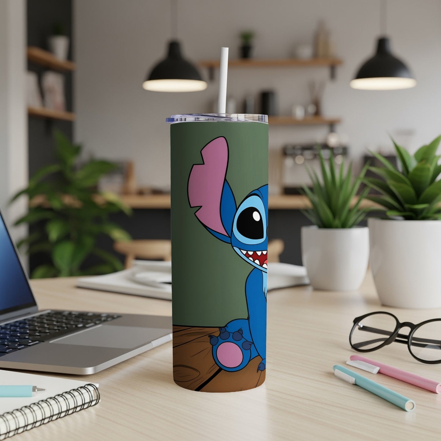 Stitch cartoon character on a green tumbler with a wooden desk background.