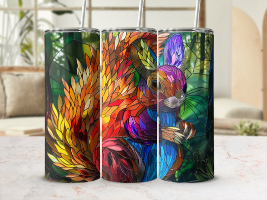 Triptych of stained glass squirrels in vibrant colors on a marble surface.