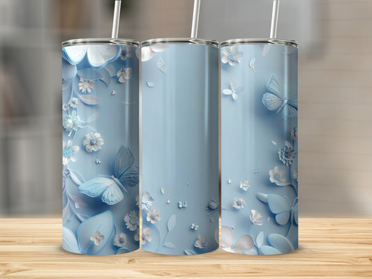 Three light blue tumblers with white butterfly and floral designs.
