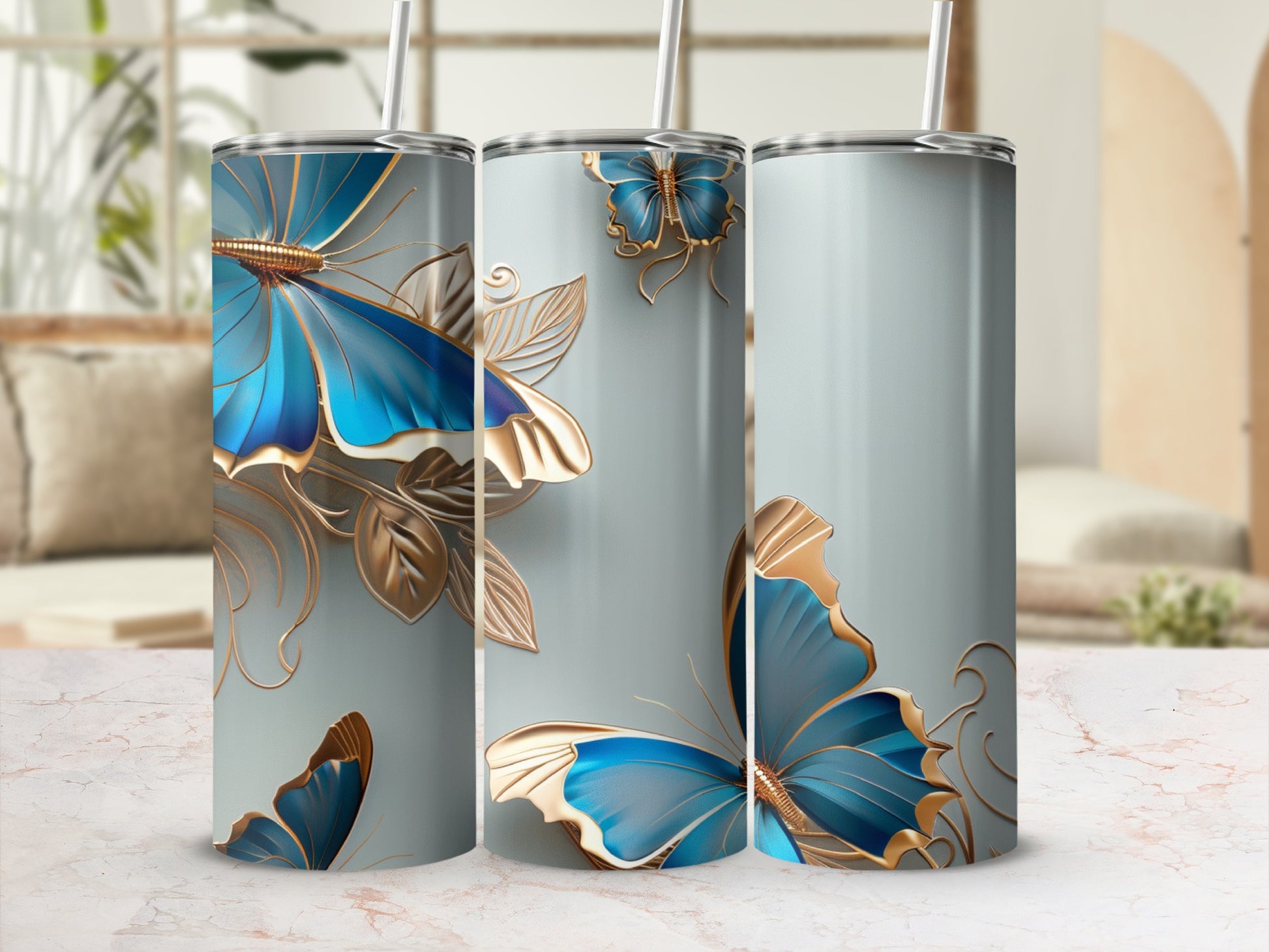 Light blue tumbler with gold and blue butterfly design.
