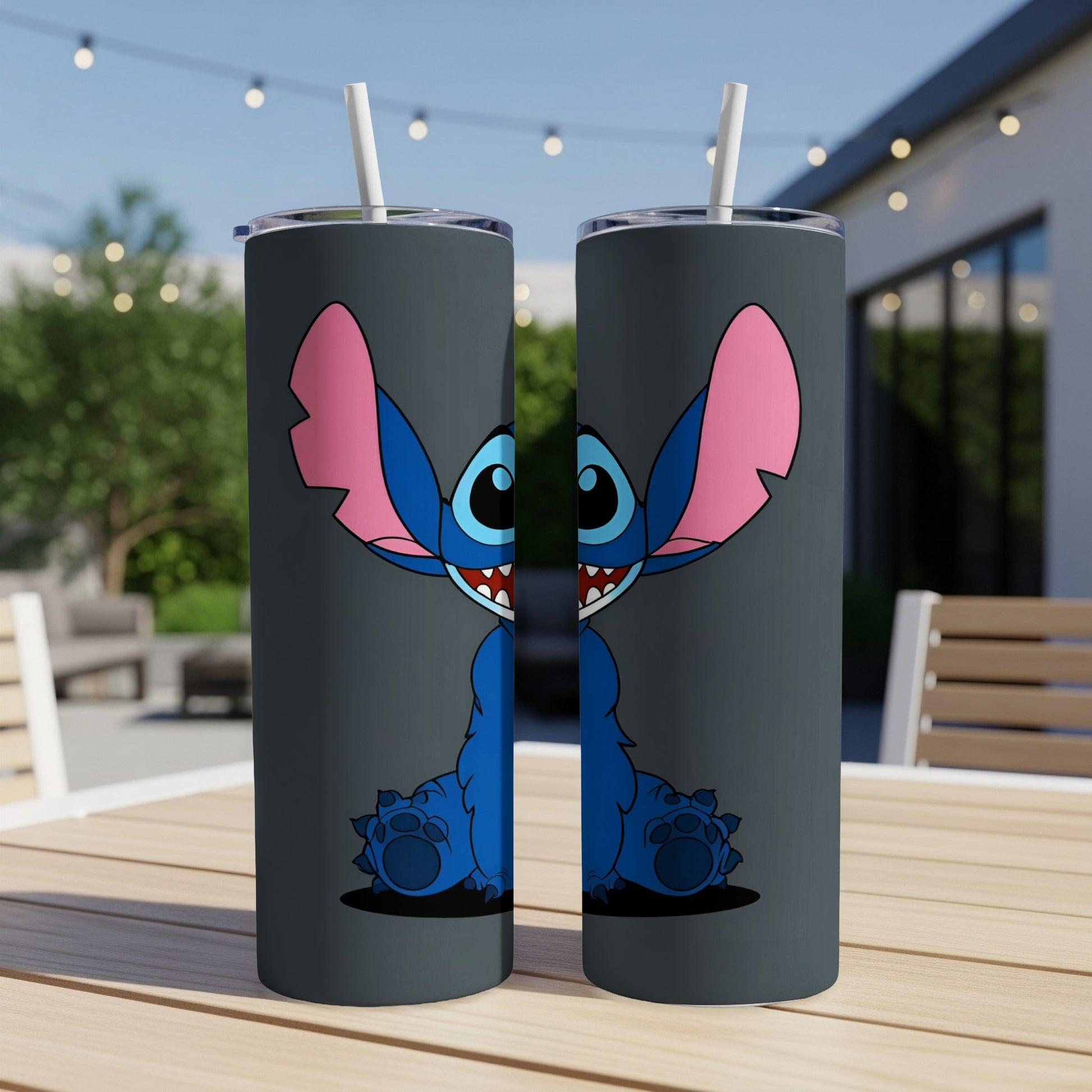 Two dark gray tumblers featuring Stitch with wide open mouth and large ears.