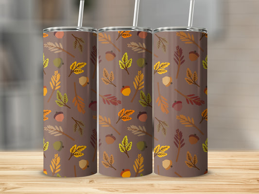 Brown tumbler with a repeating pattern of autumn leaves and acorns.