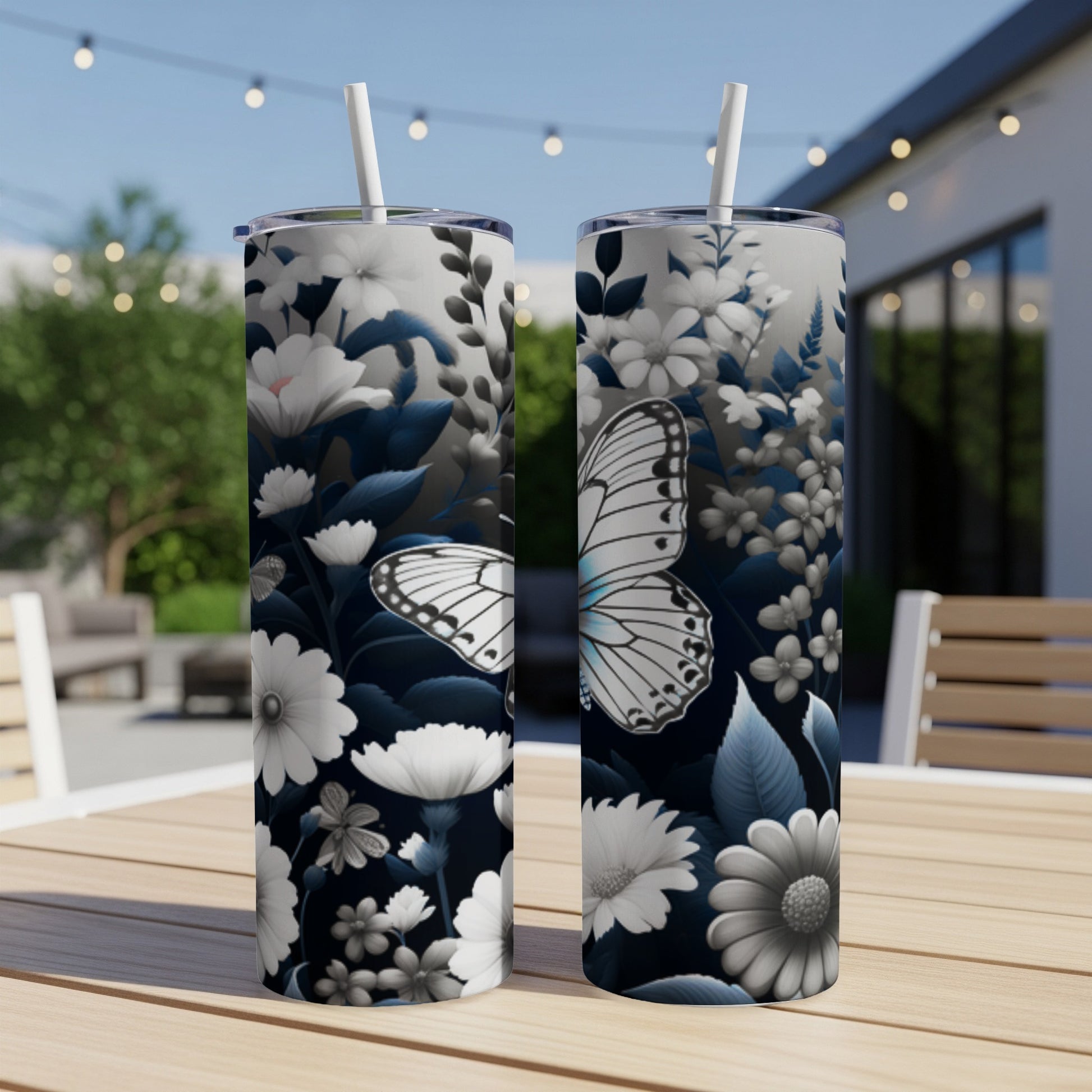 Two tall tumblers with a white butterfly and floral design.