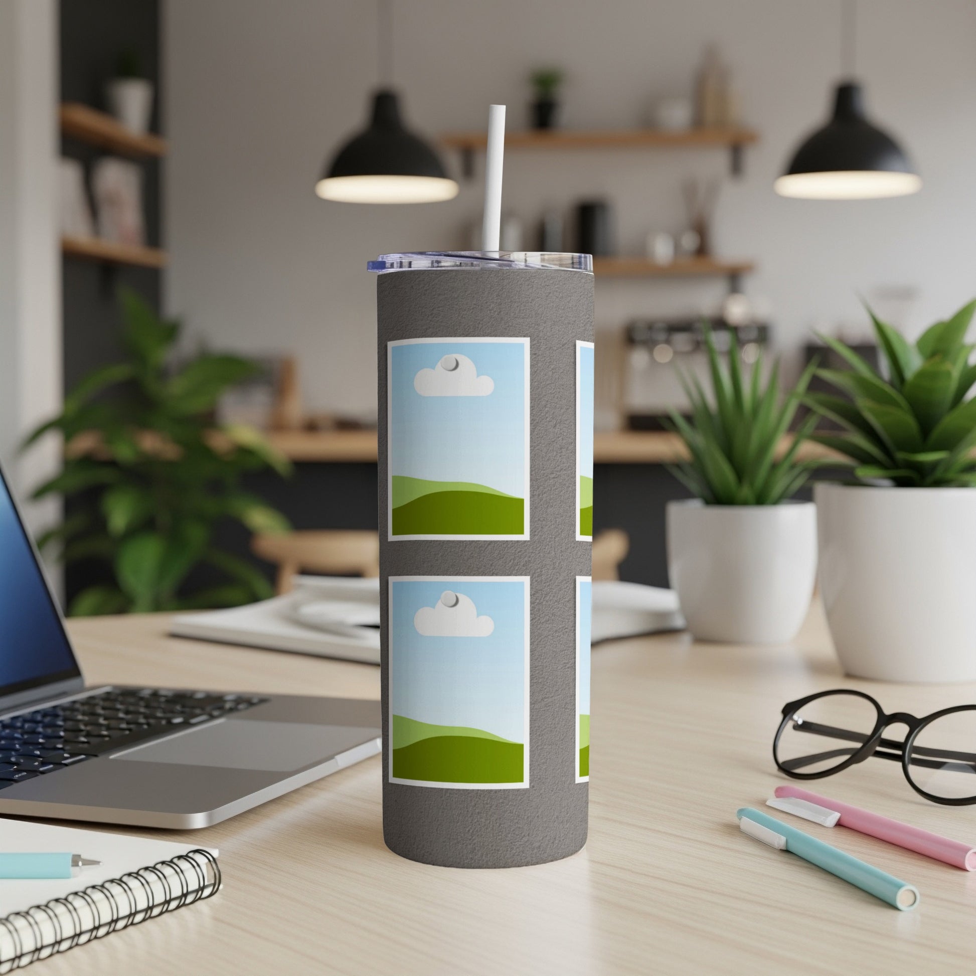 Gray tumbler with attached straw, featuring four framed images of landscapes.