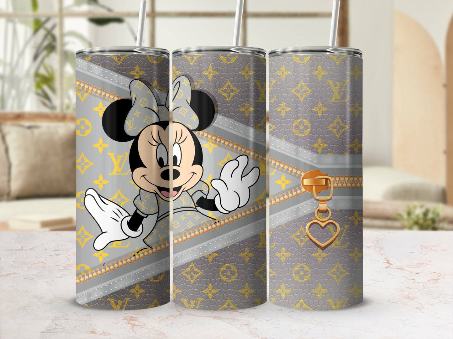 Minnie Mouse on grey patterned tumbler with gold zipper and heart charm.