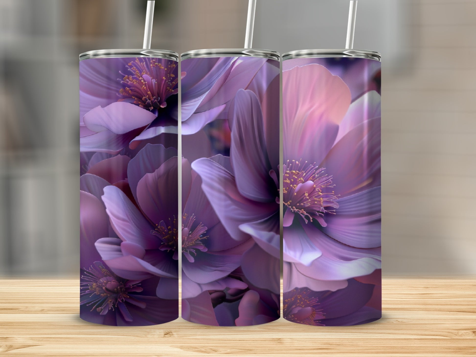 Three tumblers with a purple floral design stand on a wooden surface.
