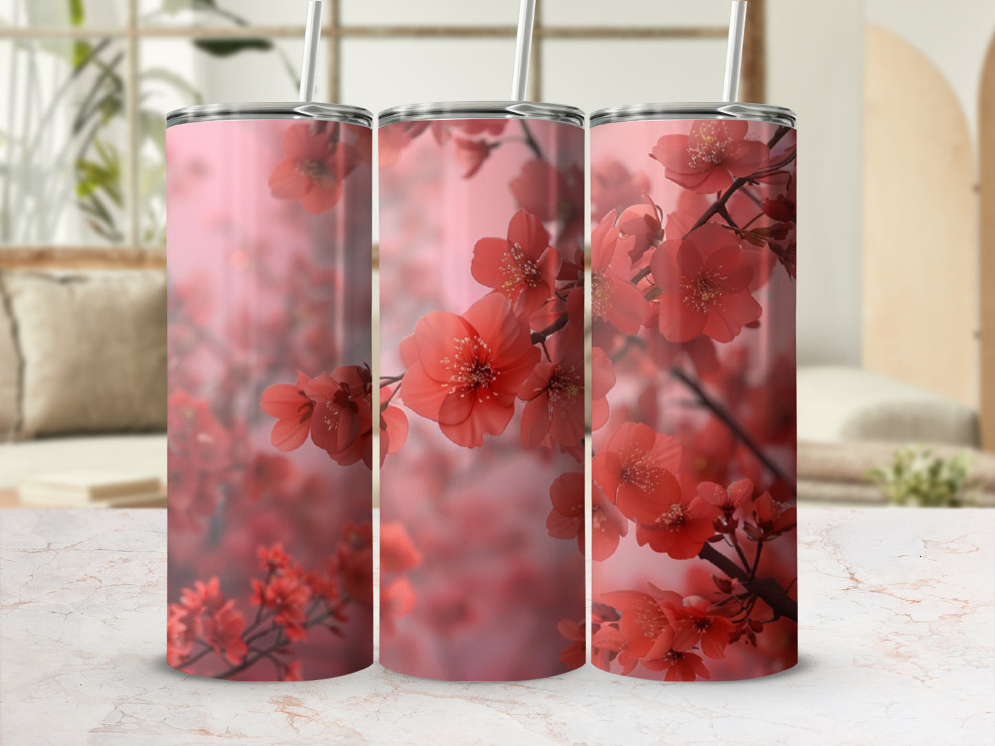 Pink cherry blossoms on a pink tumbler with a straw.