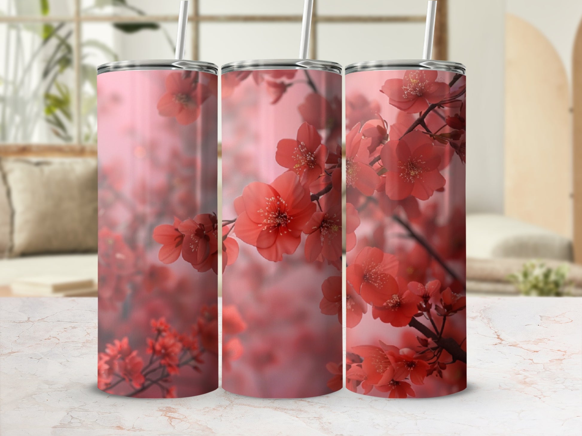 Pink cherry blossoms on a pink tumbler with a straw.