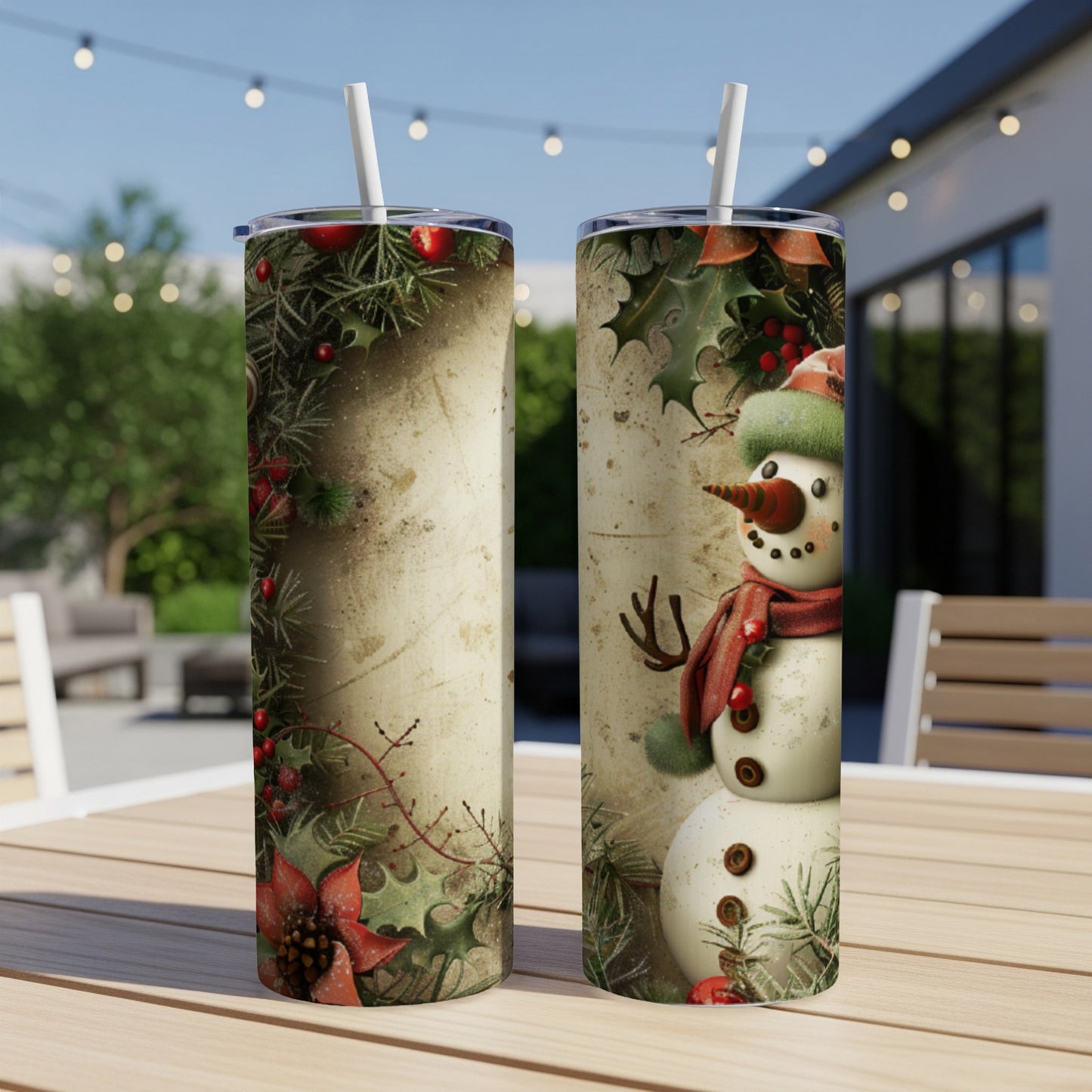 Two cylindrical tumblers featuring a snowman design with festive greenery and poinsettias.