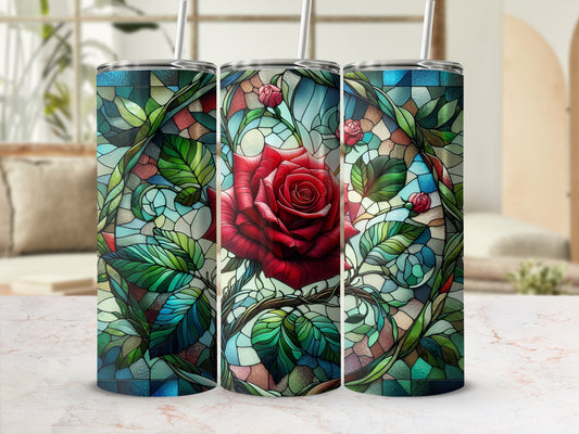 Stained glass design with a red rose and green leaves on a tumbler.
