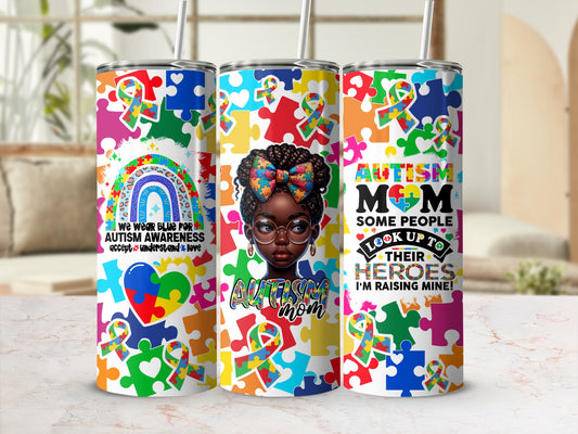 Autism Awareness tumbler with puzzle pieces, rainbow, and "Autism Mom" text.