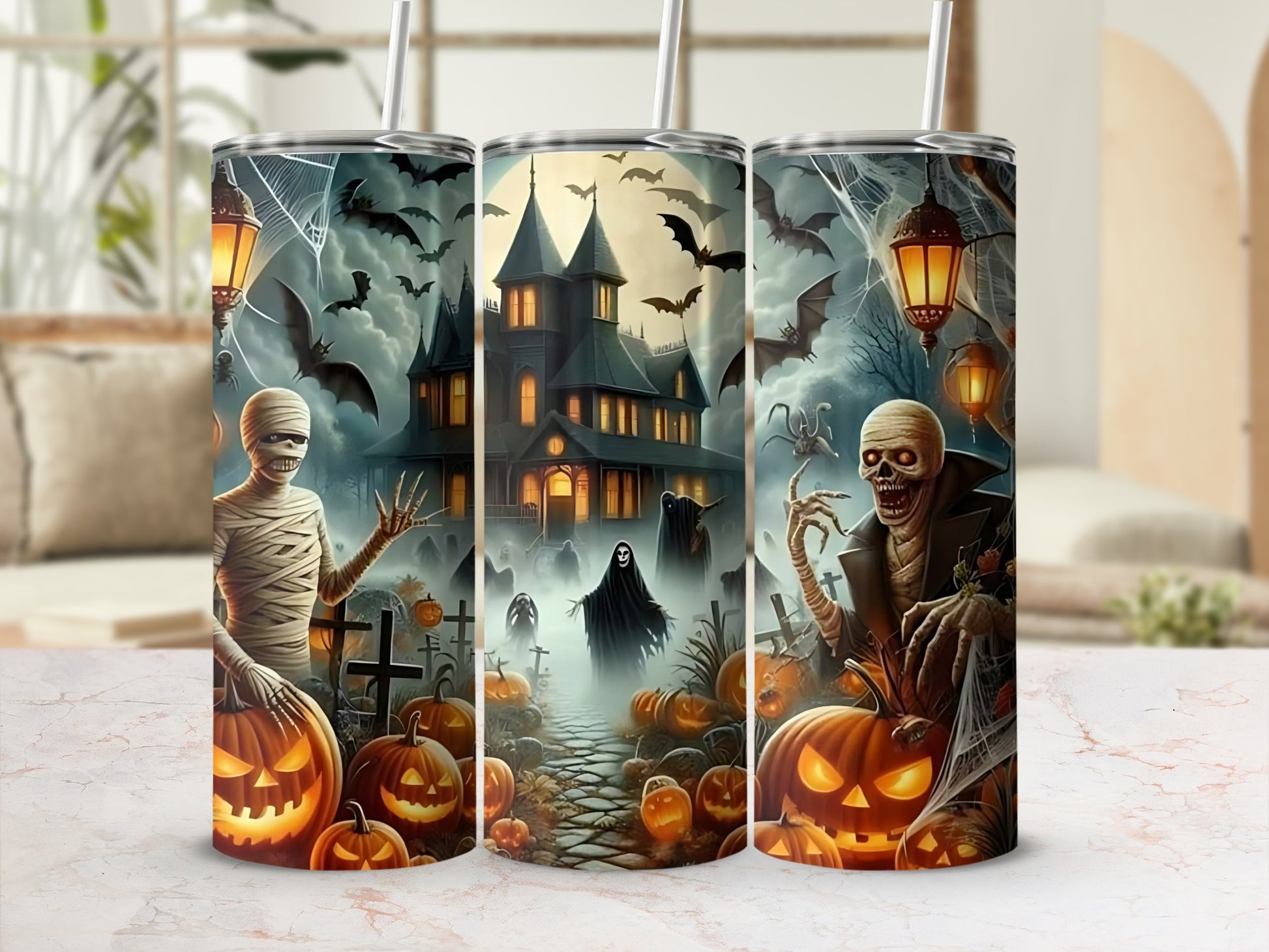 Halloween tumbler with mummy, skeleton, ghost, haunted house, pumpkins, and bats.