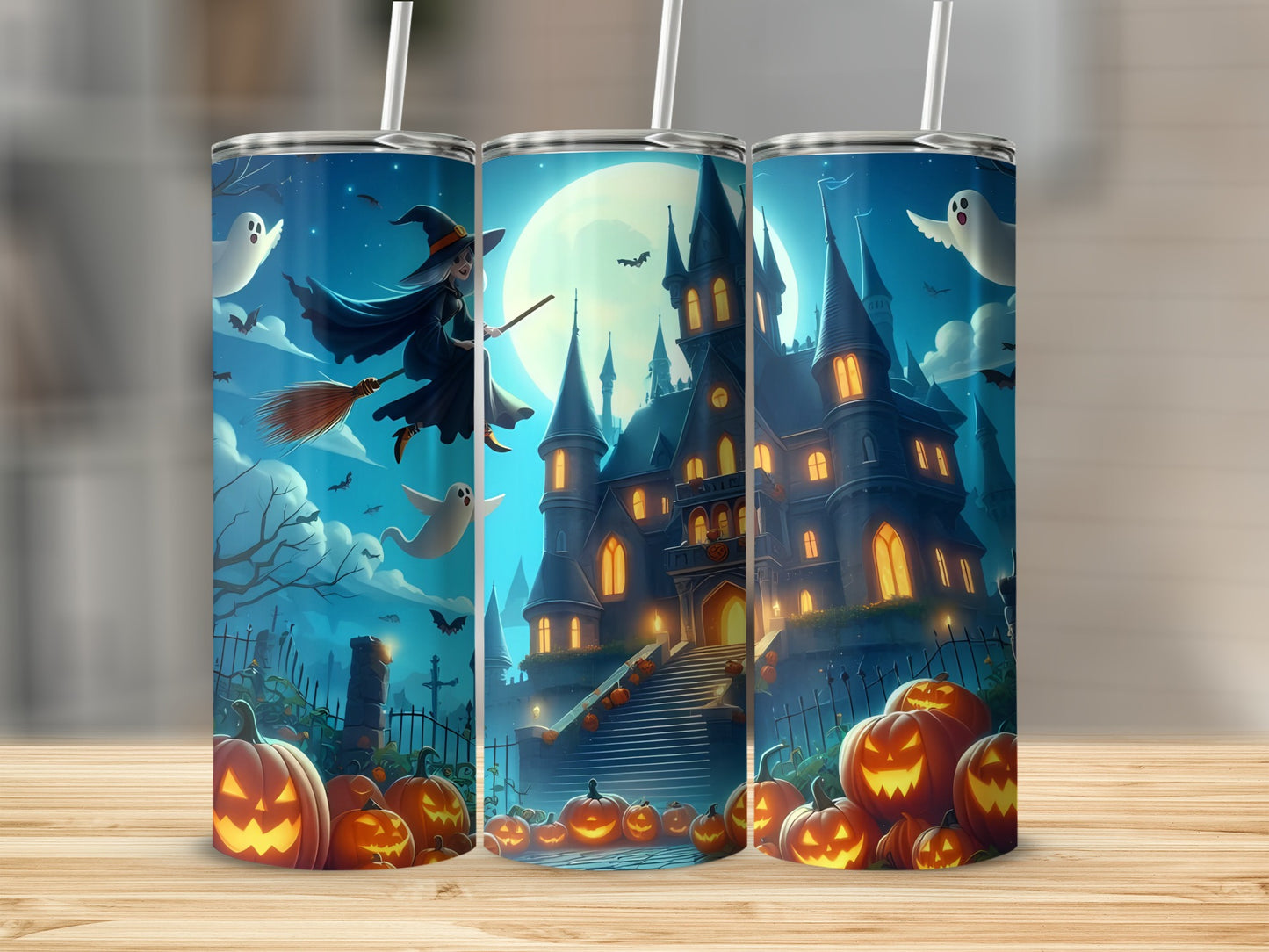 Halloween tumblers with a haunted castle, witch, ghosts, bats, and pumpkins.