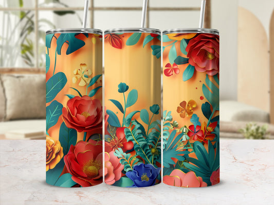Three tumblers with vibrant floral designs and warm, gradient backgrounds.