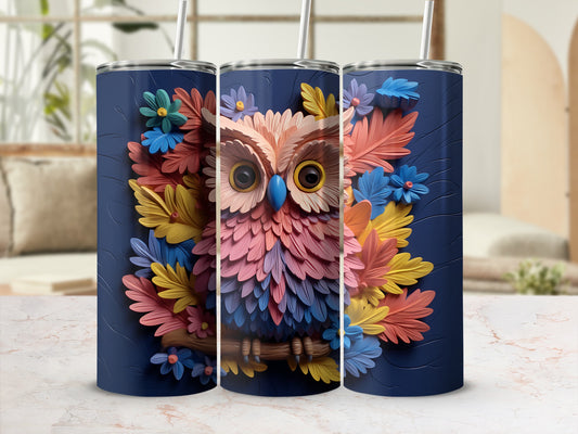 Dark blue tumbler with a colorful owl and floral design.