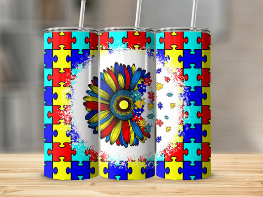 Sunflower with puzzle pieces design on a tumbler.