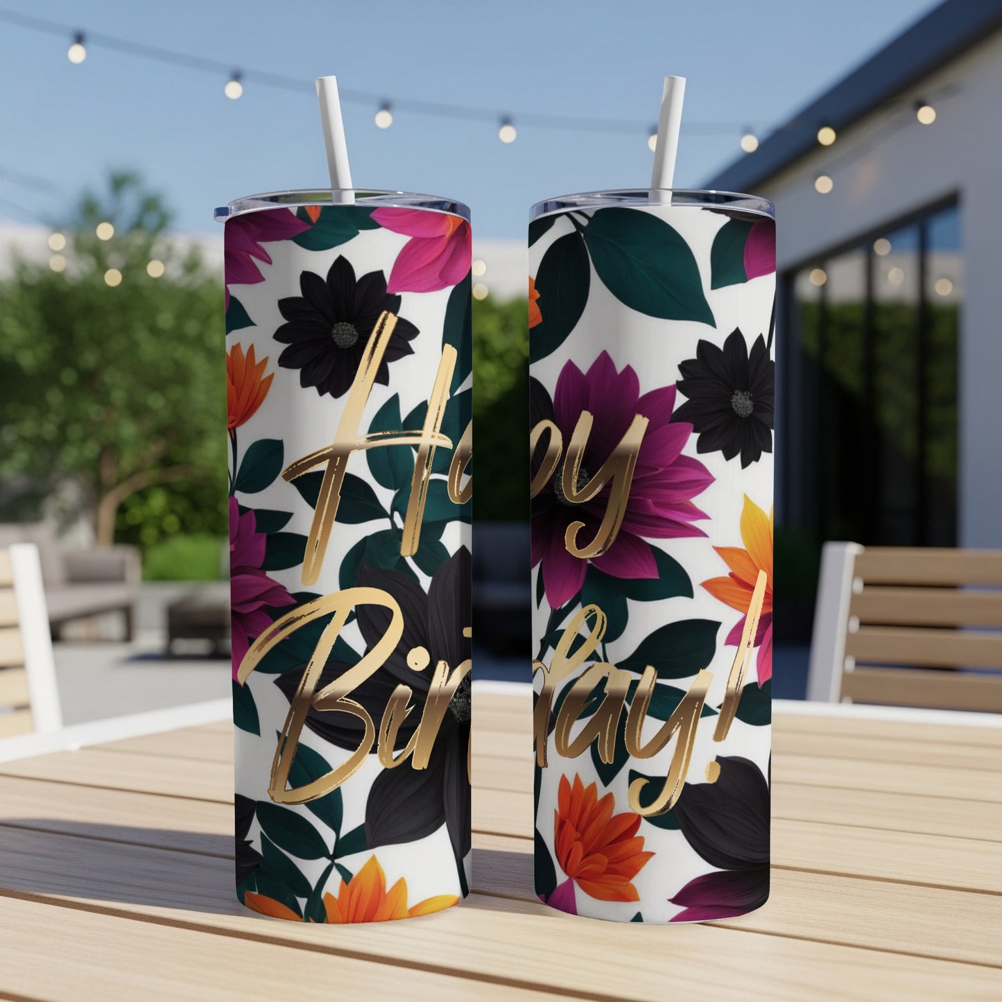 White tumbler with "Happy Birthday!" in gold lettering and floral pattern.
