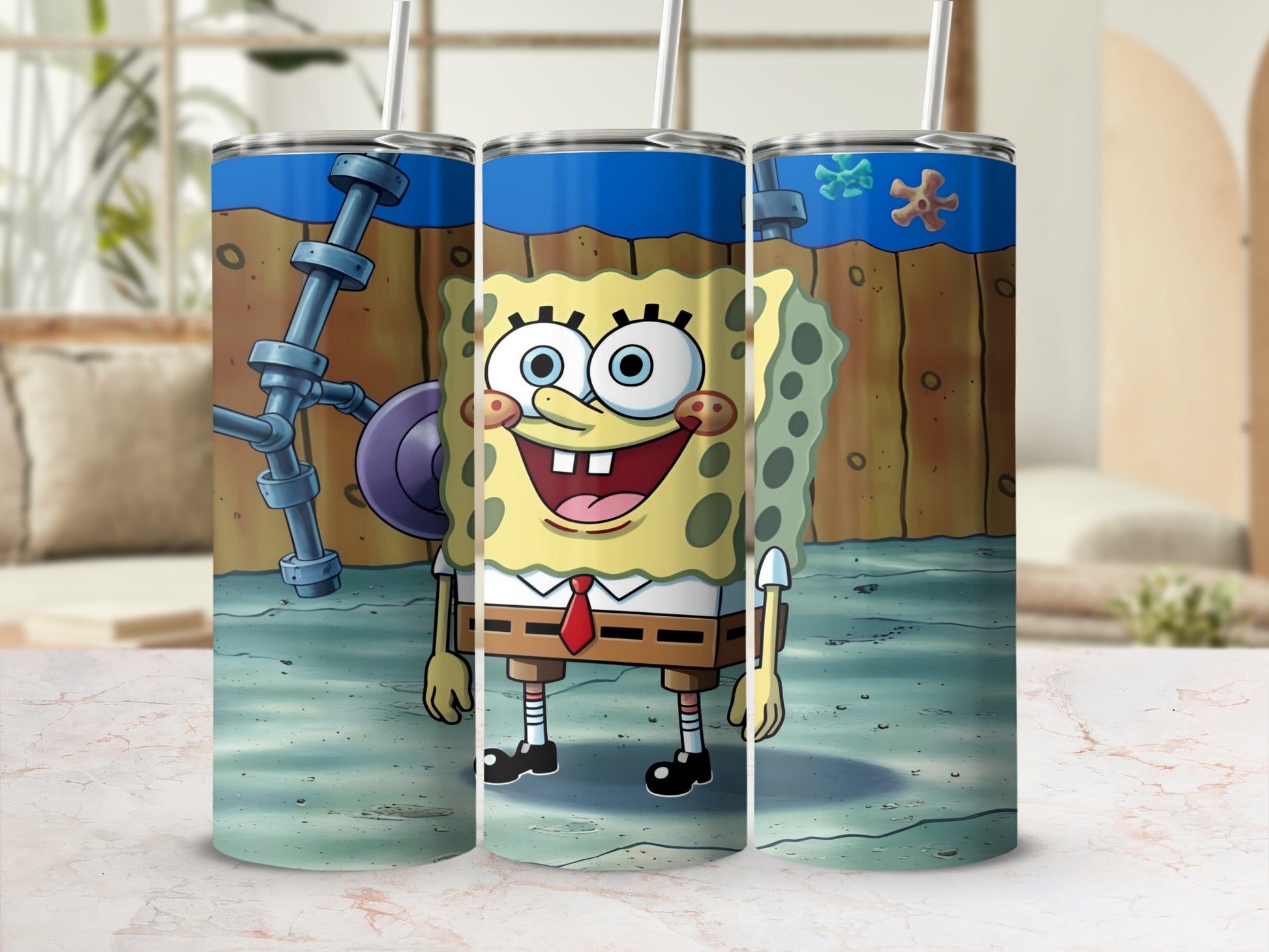 SpongeBob SquarePants character on a blue tumbler with straws.