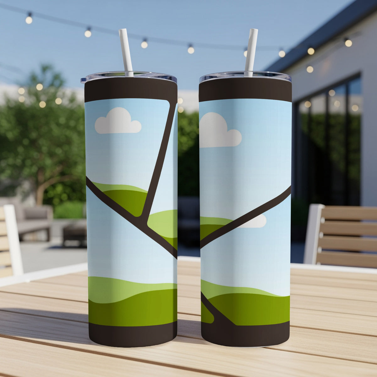 Two tumblers with a stylized green rolling hills and cloud design.