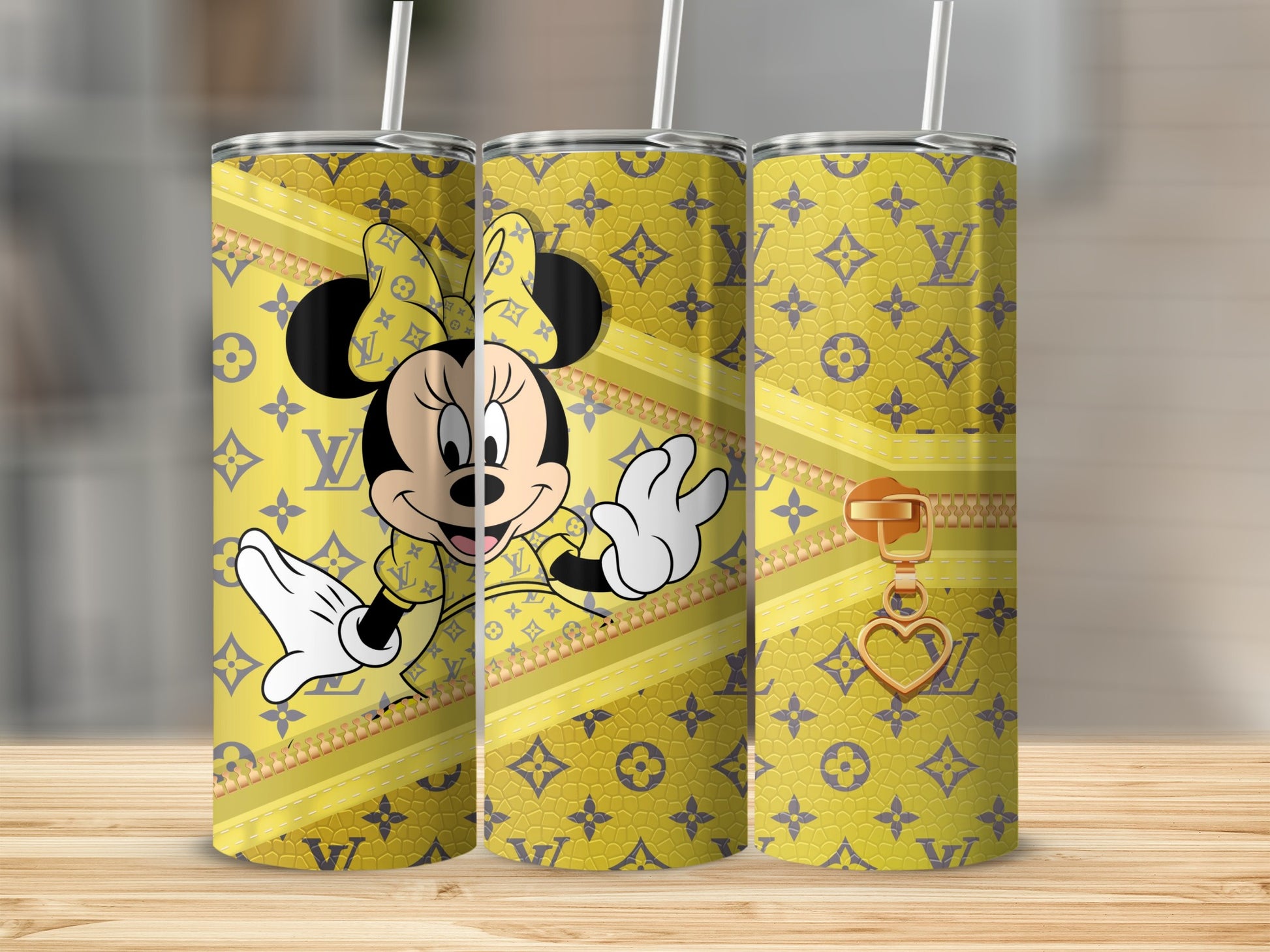 Minnie Mouse wearing a yellow bow and dress on a tumbler with LV pattern and gold zipper.