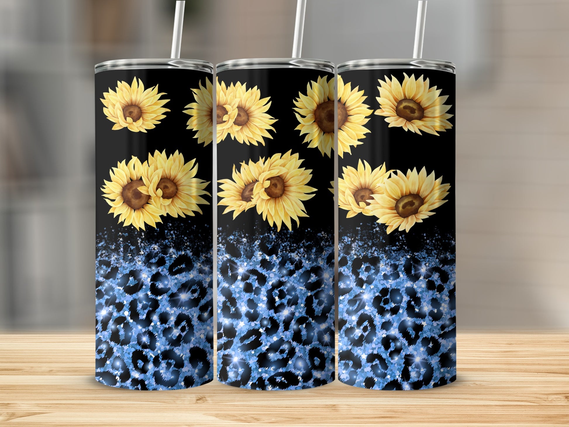 Three black tumblers with sunflowers and blue leopard print.