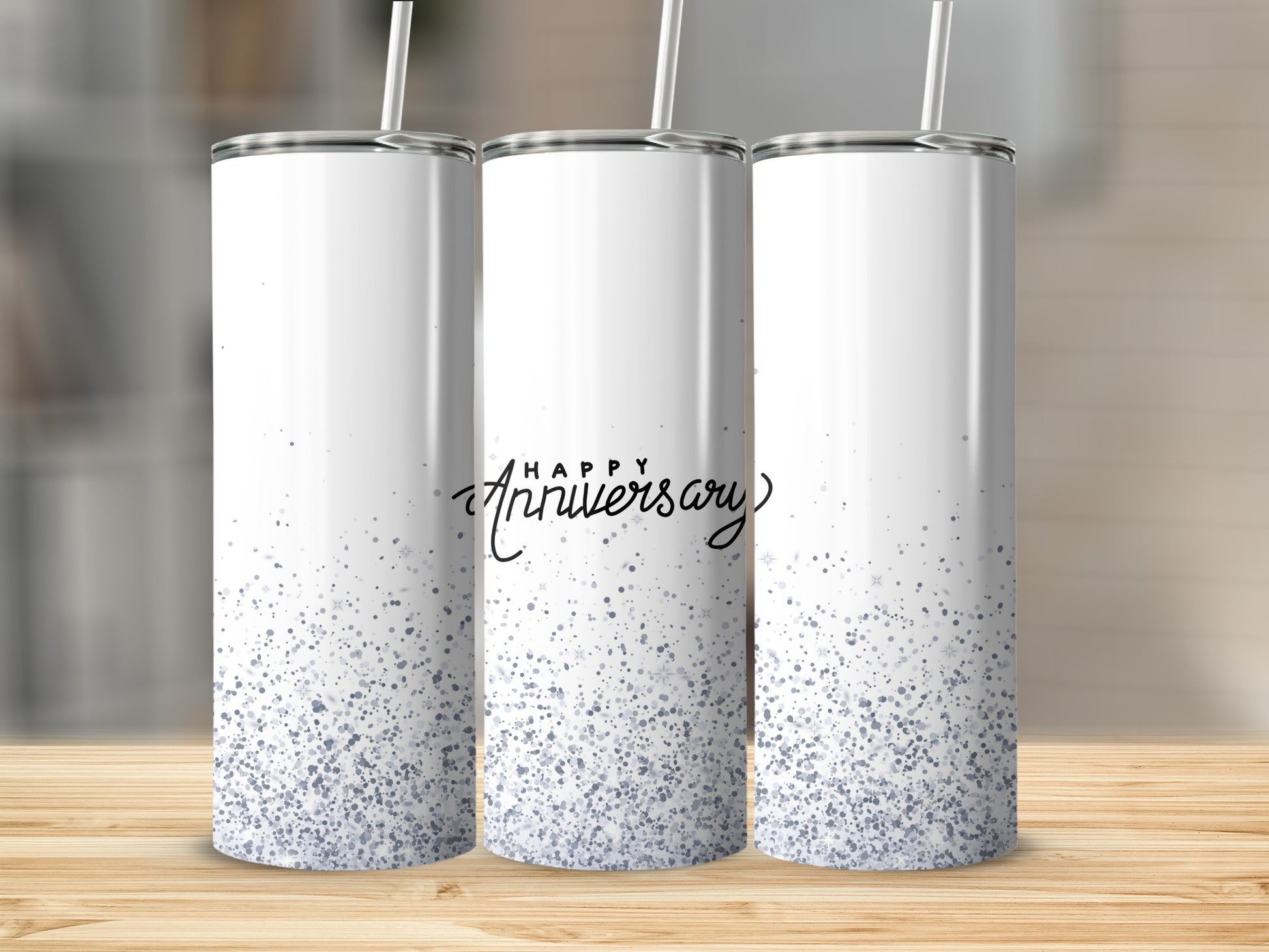 Three white tumblers with "Happy Anniversary" and glitter detail.